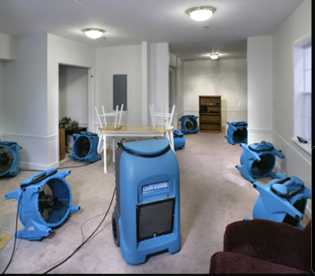 Air movers and dehumidifier setup for Water Damage Restoration in Liberal