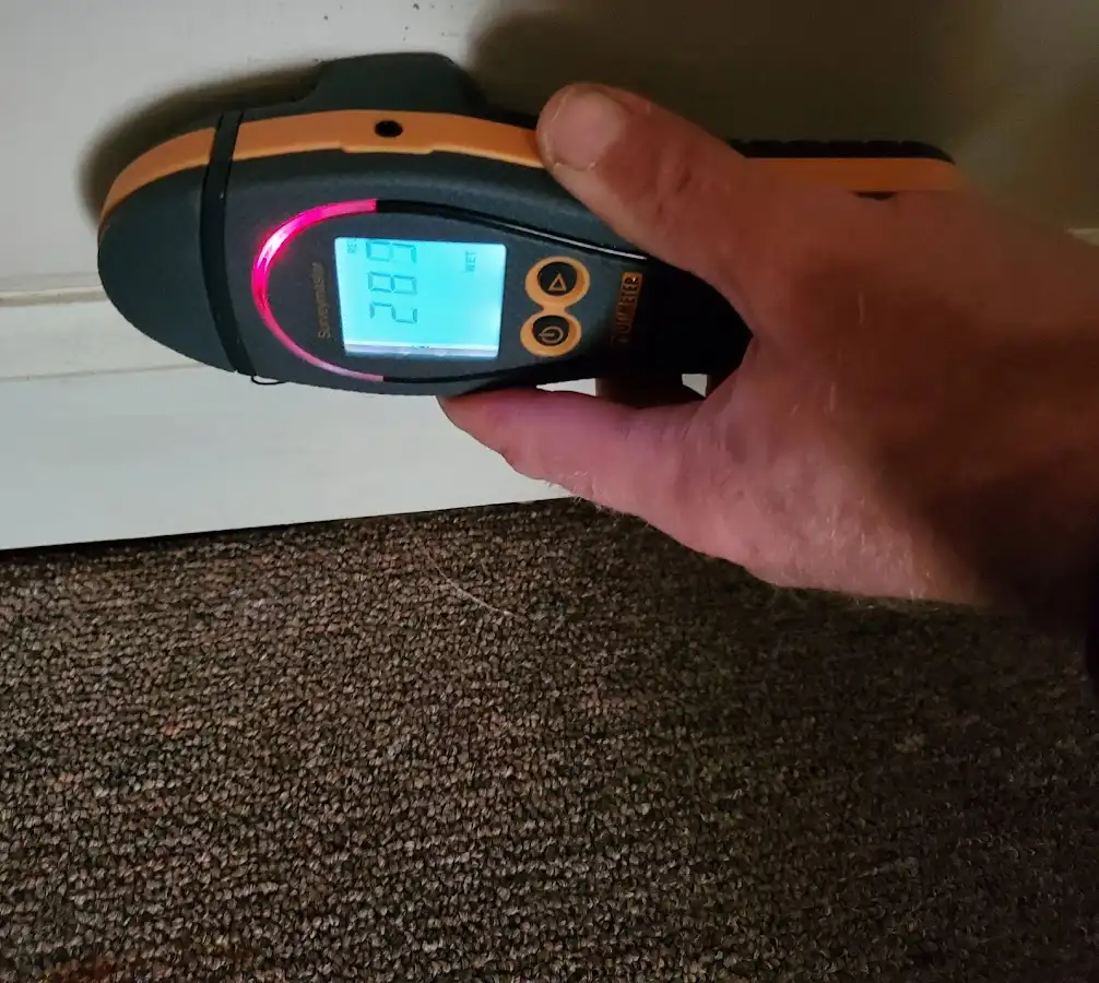 Moisture detection at baseboard during Burst Pipe Cleanup in Liberal